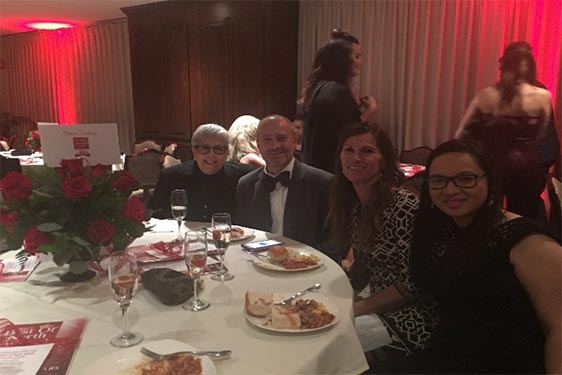 Sue Groszkiewicz, Brett Samuels, Andrea Samuels and Jane Ho enjoy dinner and festivities.